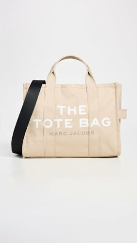 Beige Marc Jacobs tote bag with black strap.
