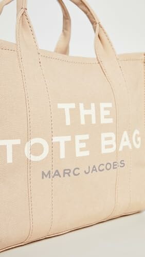 Beige tote bag with text.