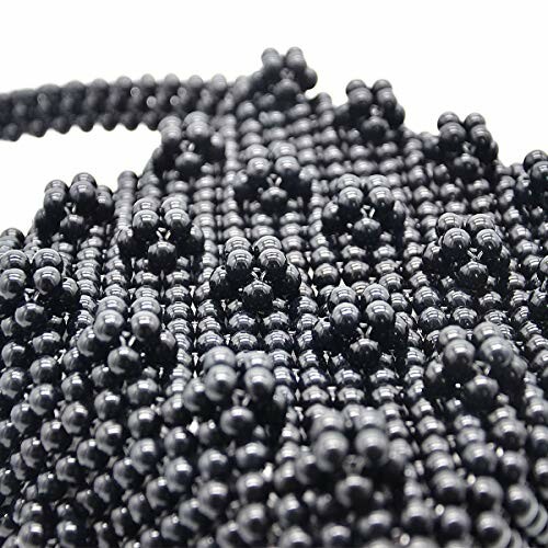 Close-up of black beaded texture with intricate pattern