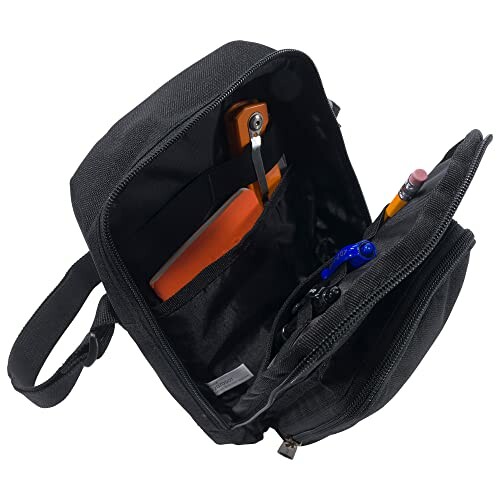 Open black messenger bag with pockets containing phone, pens, and notebook.