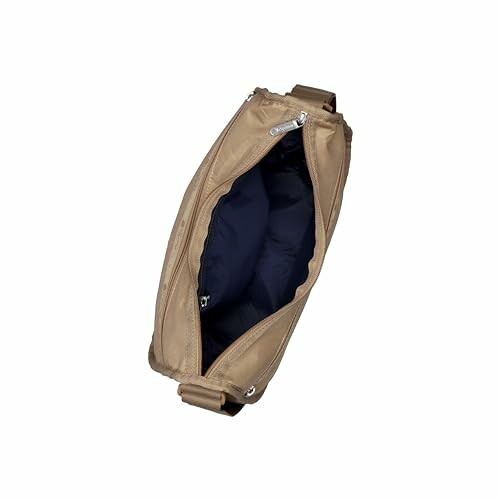 Open brown leather bag with dark interior